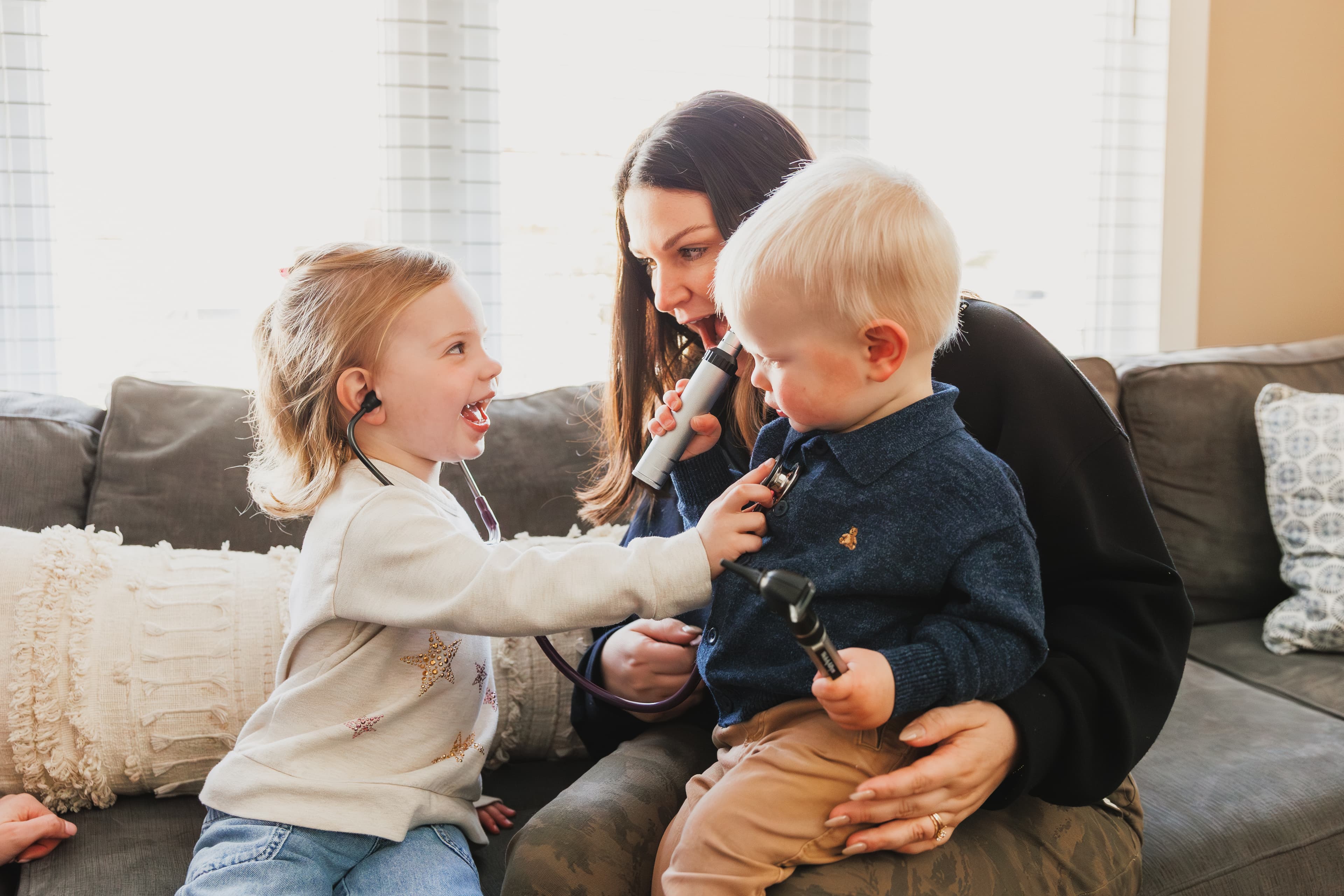 A parent holding their happy baby, representing the warm, family-centered care at Core Care Pediatrics