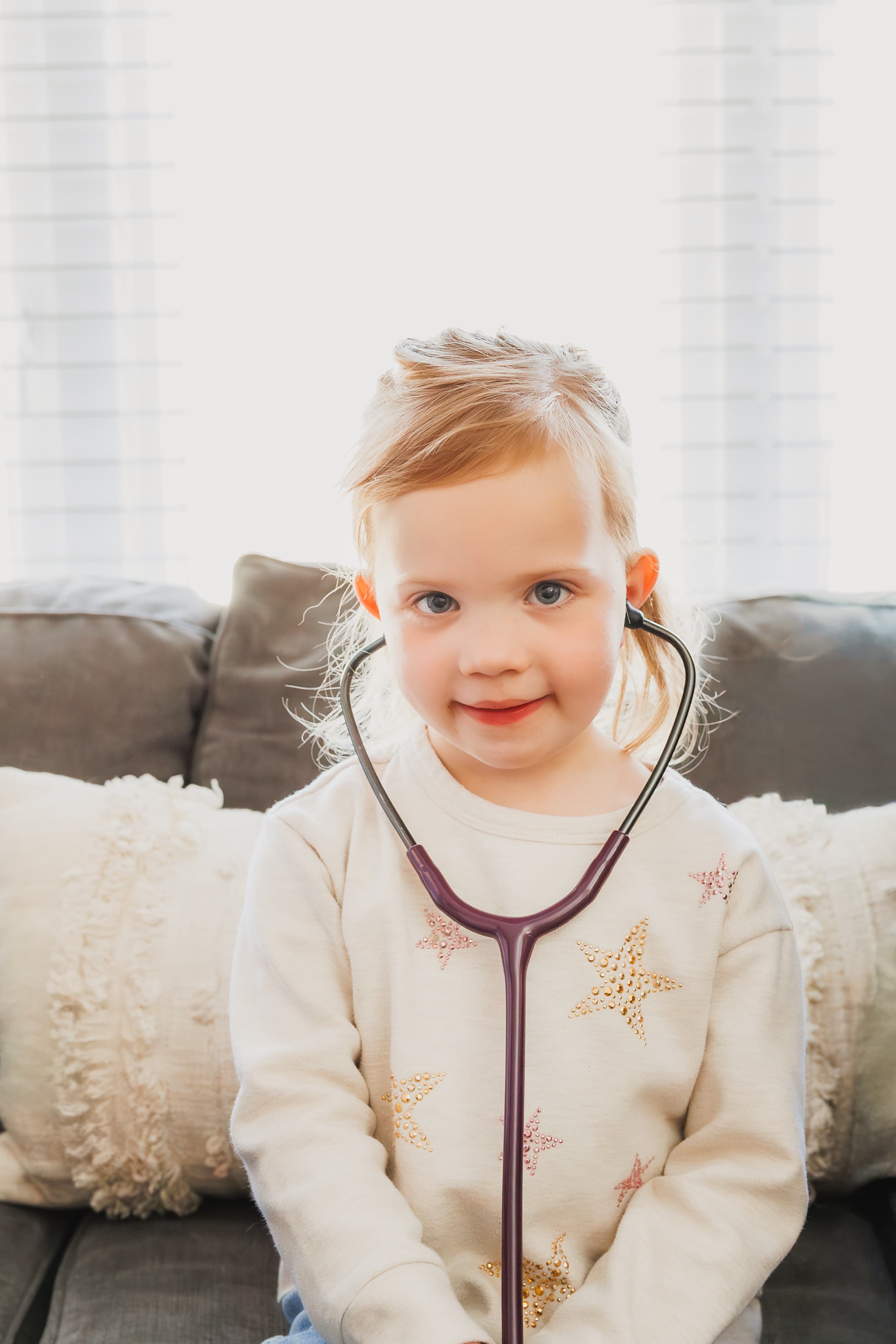 Pediatrician supporting a child with ongoing care for managing chronic medical conditions